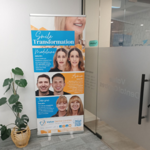 A pull up banner for Value Dental Centres on display in their office.