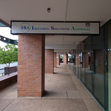 An under awning sign for Inclusive Solutions Australia