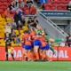 Lions FC WNPL team celebrating in huddle