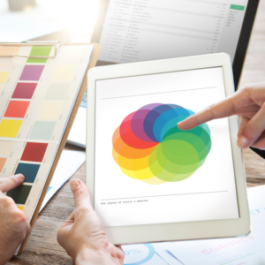Two people selecting colours from swatches