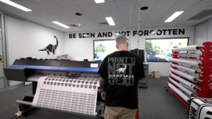 Signosaur Production - Decal printing Signosaur production team member printing vinyl decals