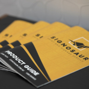 Signosaur product guides on a table