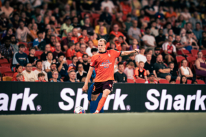 Brisbane Roar Brisbane Roar player kicking football
